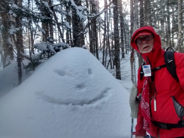 Snowba the Hut mascot (on the left)