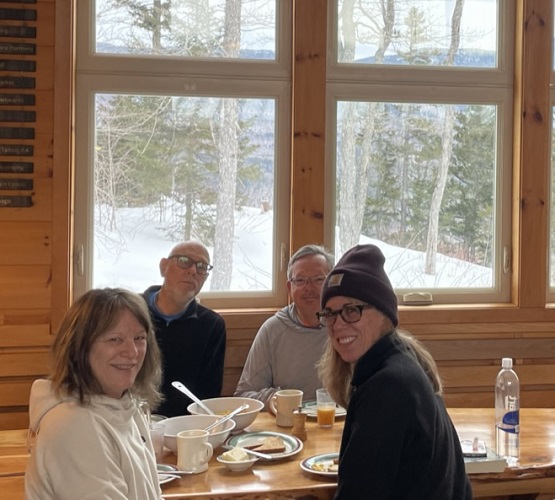 Ralph and Ed share breakfast with local Maine skiers at Stratton Brook Hut