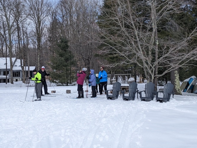 Skiers at Woods Lake trail terminus. This trail is lighted for night skiing.