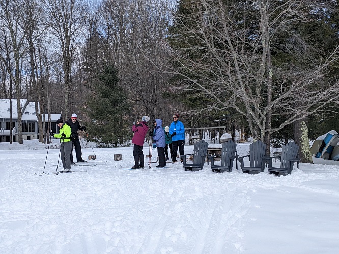 Skiers at Woods Lake trail terminus. This trail is lighted for night skiing.